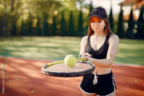 Beautiful and stylish girl on the tennis court © prostooleh