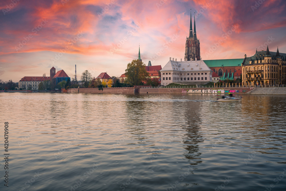 A cityscape with cathedral on Ostrow Tumski , river Odra. Wroclaw, Poland, at dusk. Panoramic view.