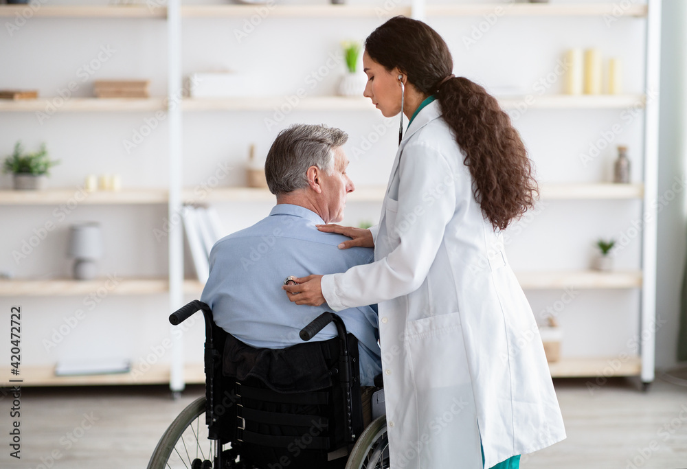 Elderly patient with physical disability receiving medical help from young physician during covid epidemic Elderly patient with physical disability receiving medical help from young physician during covid epidemic