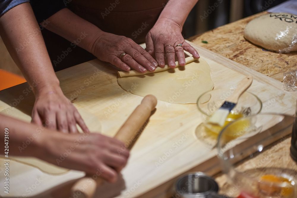 kneading, forming, rolling with a rolling pin