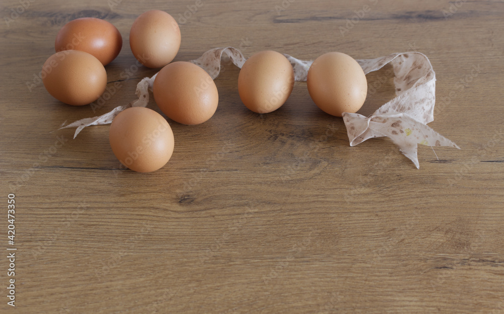 Spring, easter mock-up scene with eggs, silk ribbon, old wooden background, empty space for your text, top view. Spring, easter mock-up scene with eggs, silk ribbon, old wooden background, empty space for your text, top view.