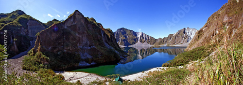 Panoramic shot of the crater lake of the volcano Mt. Pinatubo in Zambales , Philippines. photo