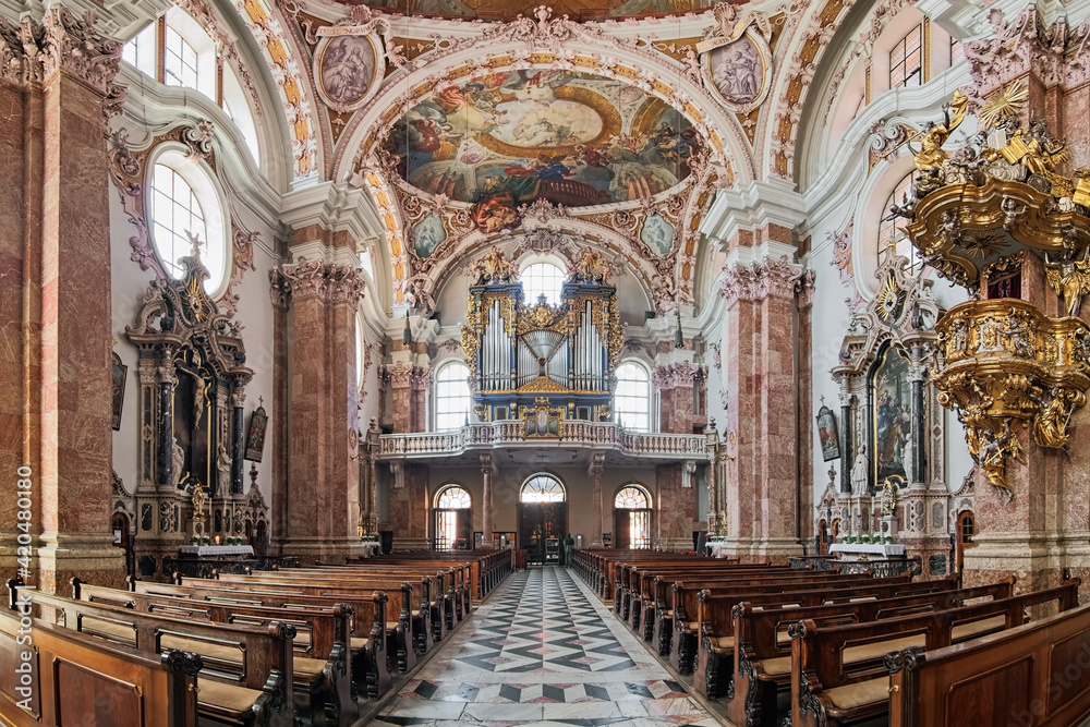 Innsbruck, Austria. Panoramic view of interior of Innsbruck Cathedral with main organ. The cathedral was built in 1717-1724.