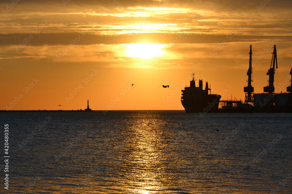 silhouette of a ship at sunset