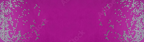 rhinestones on a purple background, top photo. design for text