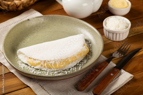 Sweet tapioca stuffed with coconut cream. Brazilian tapioca.