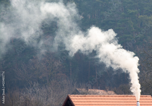 white smoke coming out of a chimney