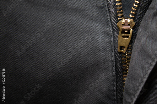 Denim with zipper. Background on the theme of denim clothing.