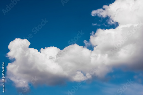 white fluffy clouds with bue sky - wallpaper