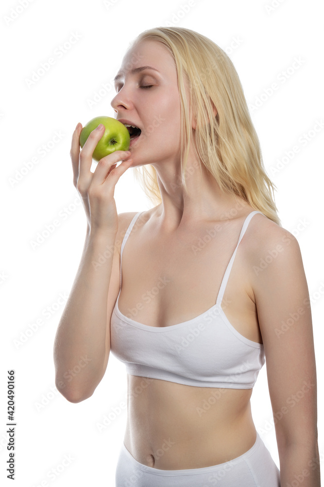Beautiful woman giving bite to green apple Beautiful woman giving bite to green apple