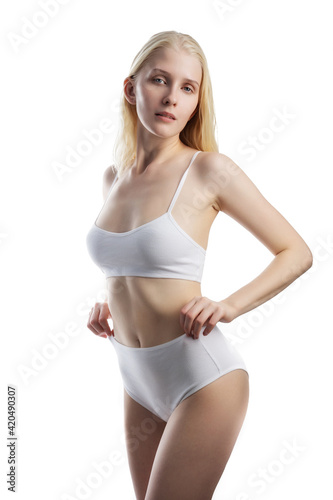 Sexy blond woman in white lingerie