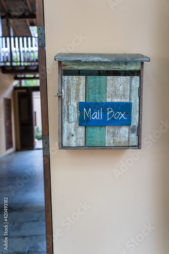 Fototapeta Naklejka Na Ścianę i Meble -  Vintage wooden mail box on wall. Thailand