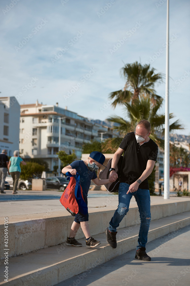 Father and son with roller skates Father and son with roller skates