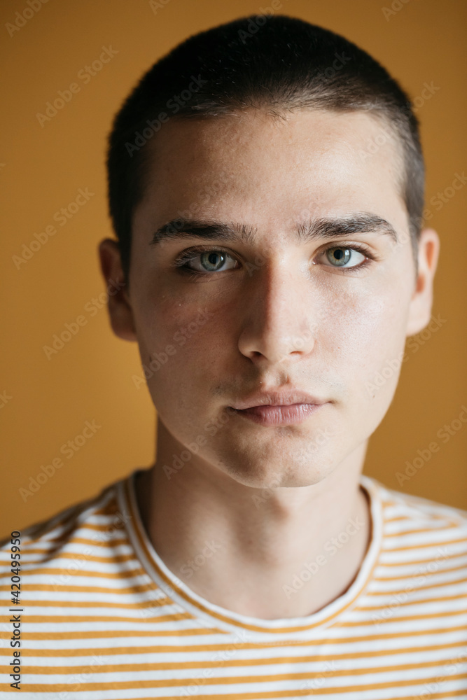 Portrait Of Young Man On Yellow Background Portrait Of Young Man On Yellow Background