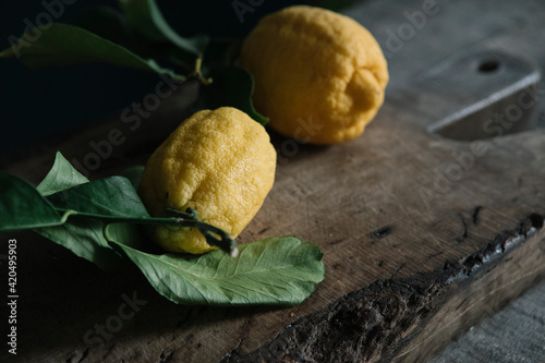 Lemons On Wooden Cutting Board photo