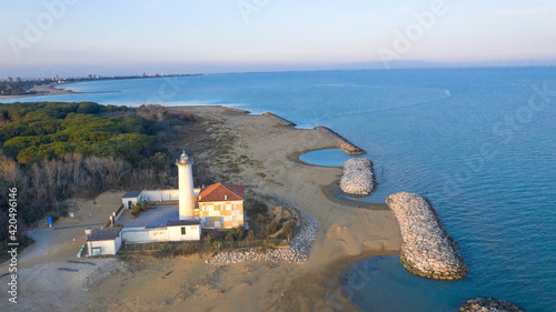 Bibione lighthouse from above at sunset in a panoramic view 