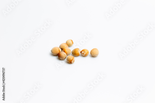 Hazelnuts isolated on white background © LilianC