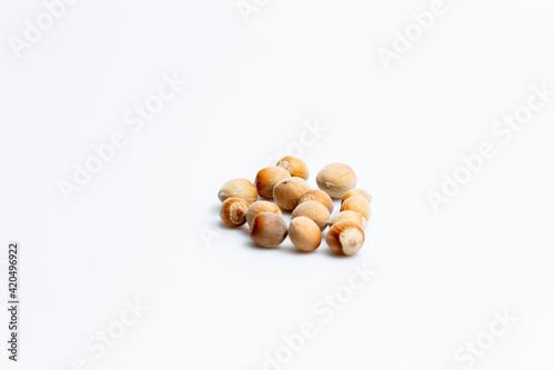hazelnuts isolated on white background © LilianC