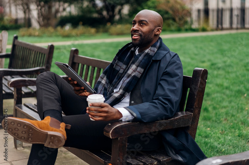 Businessman Relaxing in the Park photo