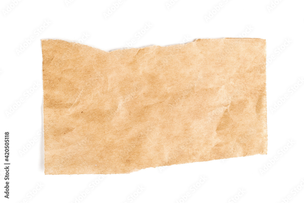 Close up of a ripped piece of brown paper on white background