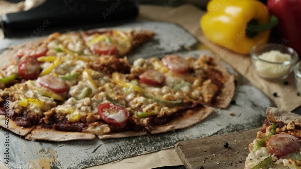 Homemade Meat and Cheese thin crust Pizza on wood table with ingredients. Homemade Meat and Cheese thin crust Pizza on wood table with ingredients.