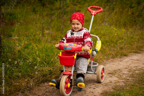 baby 3 years old on a begovel, selective focus