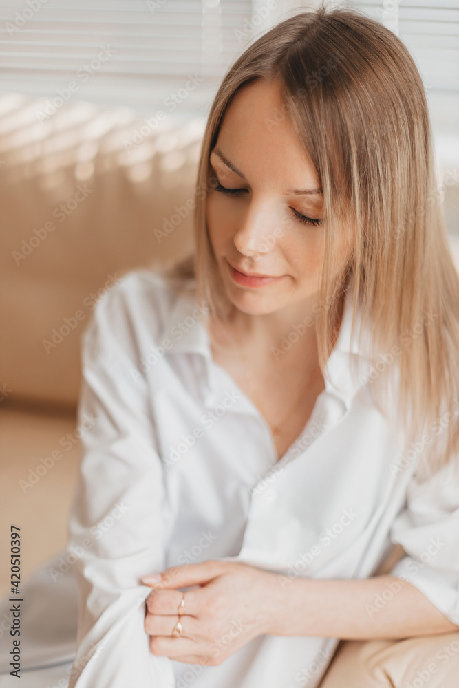 Fashion portrait of a young beautiful blonde woman indoor in studio Fashion portrait of a young beautiful blonde woman indoor in studio