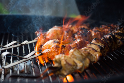 Close up of chicken shish kebabs on a grill