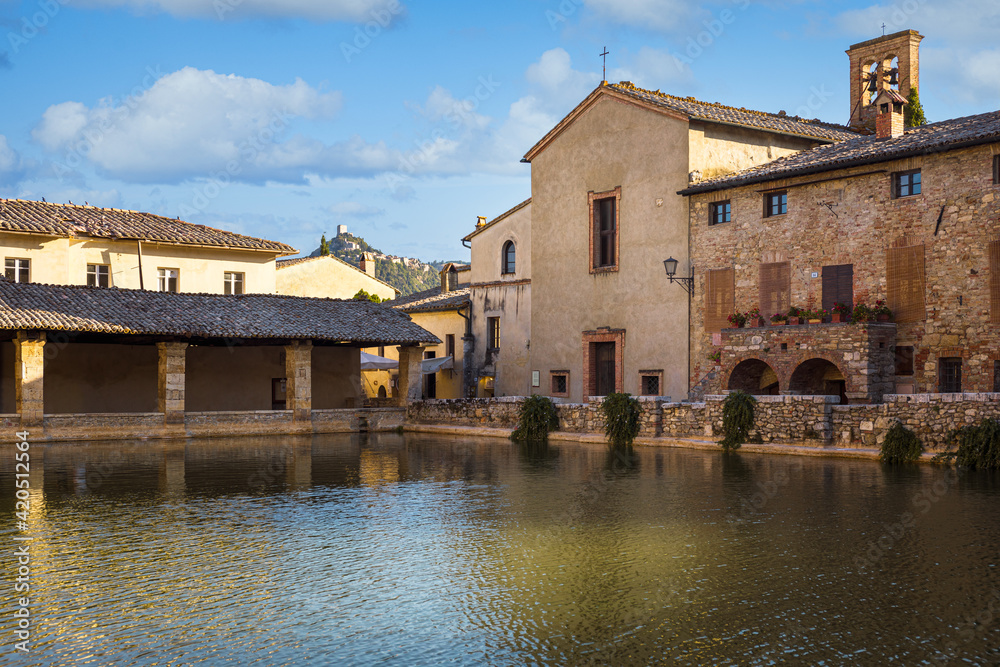 View of Bagno Vignoni hot springs, with the church of San Giovanni Battista (St. John Baptist) and Loggiato of Santa Caterina (Loggia of St. Catherine) , San Quirico d'Orcia, Italy