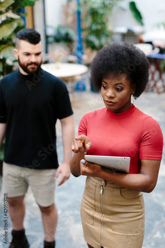 Restaurant manager giving instructions to a staff member