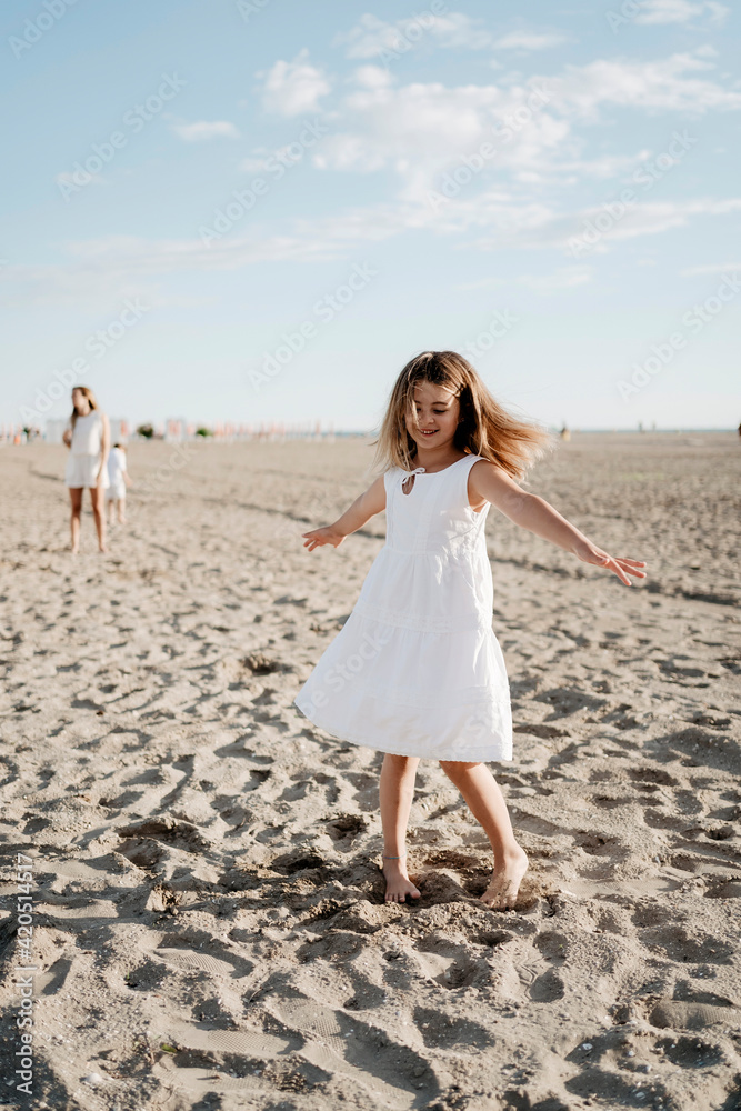 Family portraits. Kids playing on the beach in summer Family portraits. Kids playing on the beach in summer