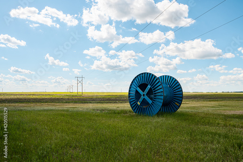 large blue cable reels on grassland photo