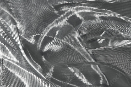 Wrinkled shiny material of silver mesh photo