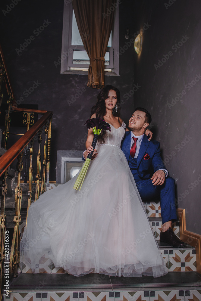 Fototapeta premium Wedding. Emotions groom at the first meeting with beautiful bride. Wedding concept