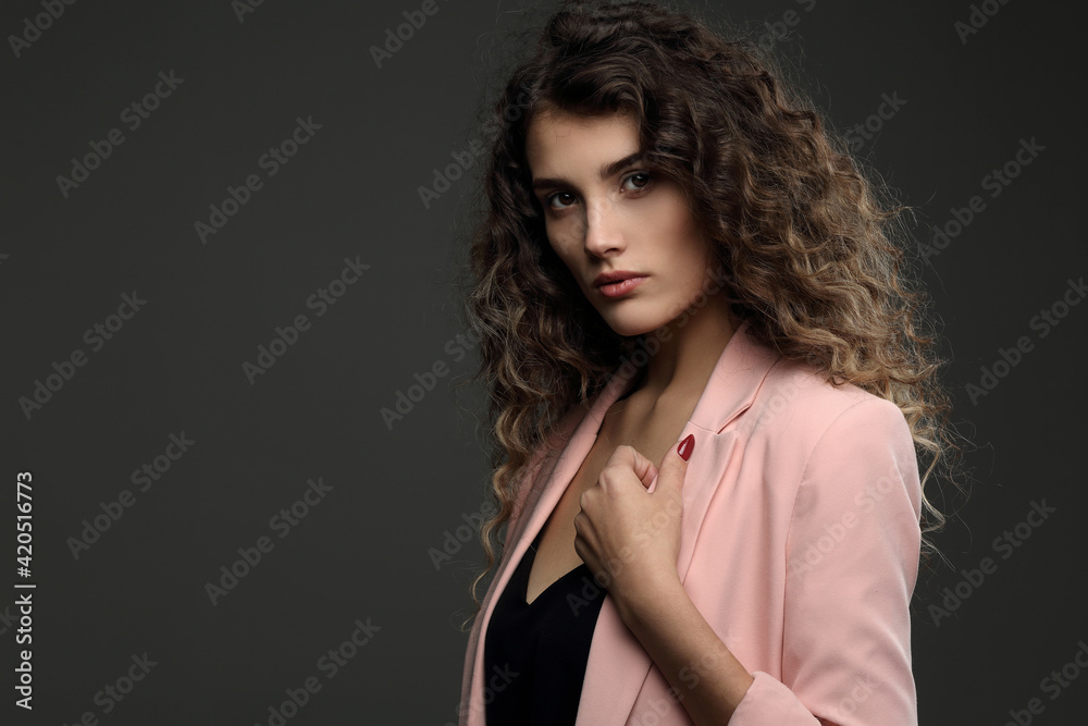 Portrait of a beautiful girl with highlighted hair on a dark background Portrait of a beautiful girl with highlighted hair on a dark background