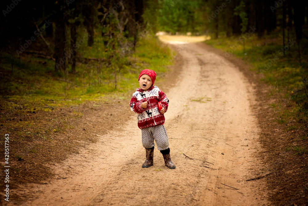 A little boy that is standing in the dirt A little boy that is standing in the dirt
