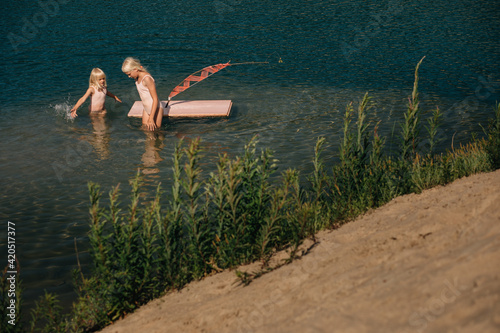 Children with toy raft photo