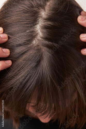 head of a Caucasian girl with hair. View from above. Close-up. h