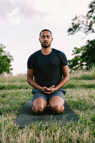 Man Meditating in Park photo