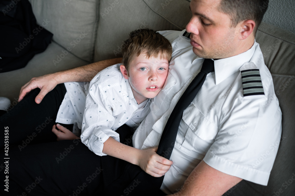 Boy Snuggling with Dad