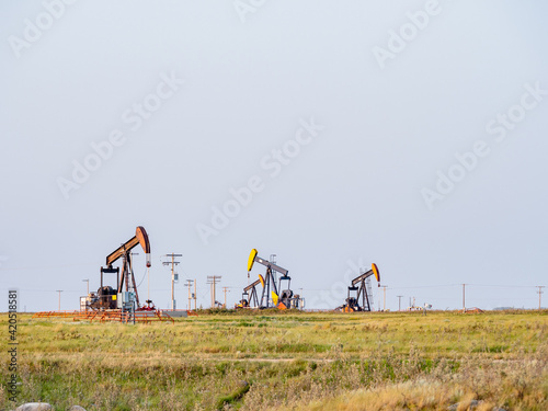 oil field pump in sunset