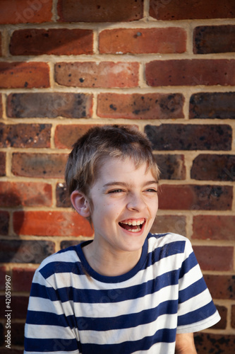 A boy laughs about his terrible haircut.