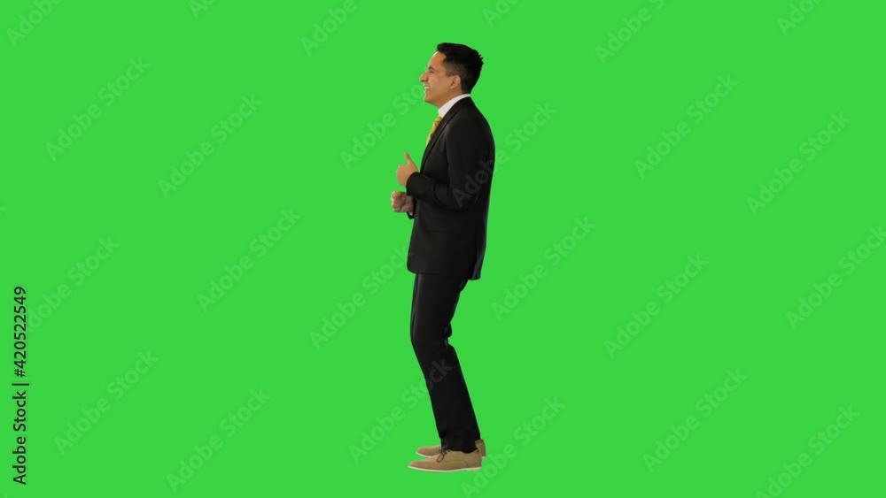Cheerful and Happy Businessman Dancing on a Green Screen, Chroma Key.