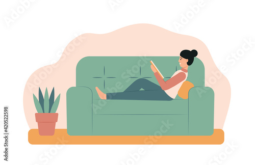 Young woman reading a book on a sofa. Happy girl sitting with a book at home. Lifestyle concept. Vector illustration in flat style