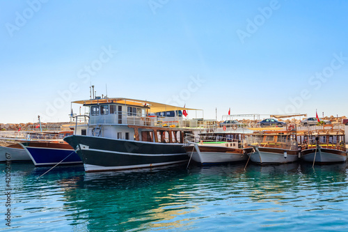 Port with tourist boats on the Mediterranean sea coast in Turkey