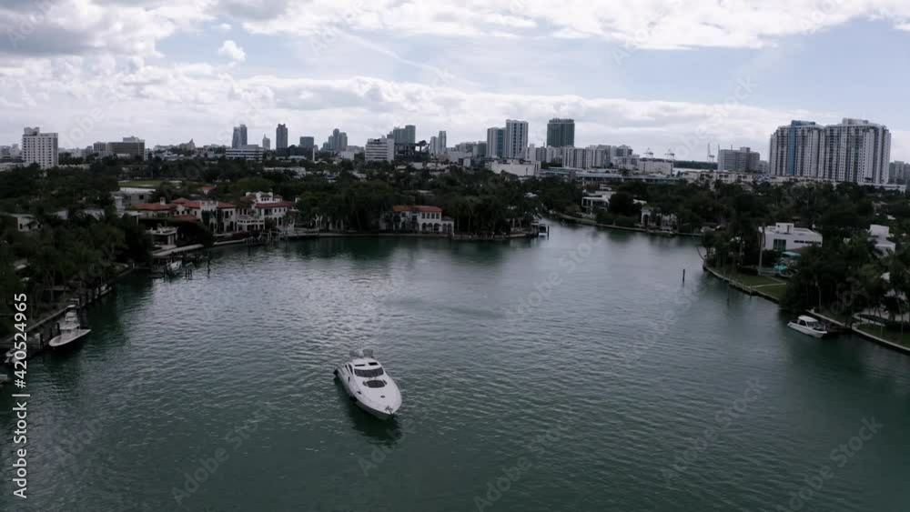 Orbiting around a luxury yacht, Revealing the Miami Florida skyline, aerial Orbiting around a luxury yacht, Revealing the Miami Florida skyline, aerial