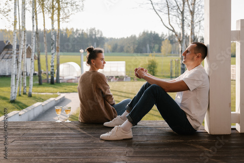 Young couple resting on veranda