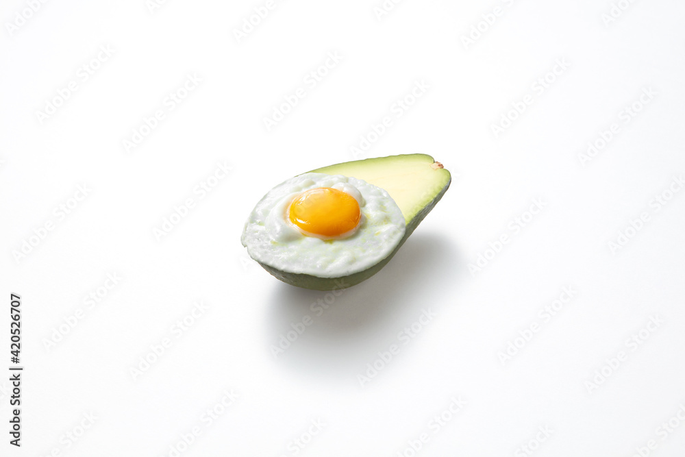 Fresh avocado half with fried egg. Fresh avocado half with fried egg.