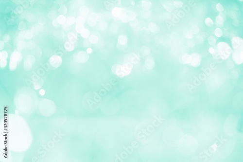 Abstract biscay green pastel bokeh lights background. photo