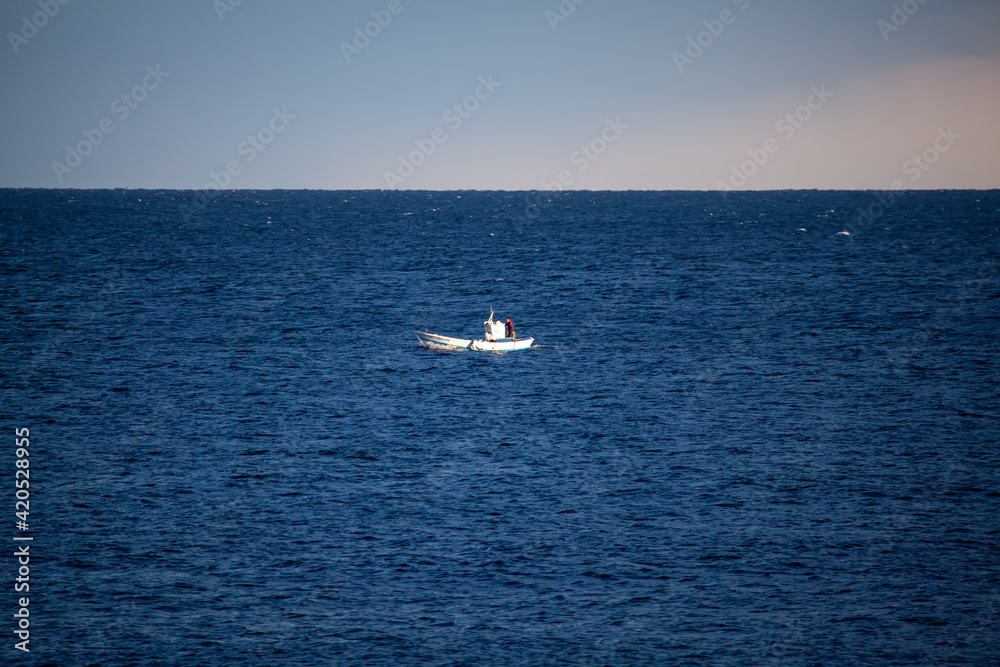 Small fishing boat while fishing on the Mediterranean Sea in Cabo de Gata Spain Andalusia